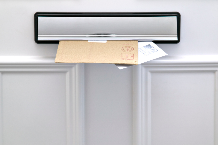 what-is-an-intumescent-letterbox-featured-image letters through intumescent letterbox