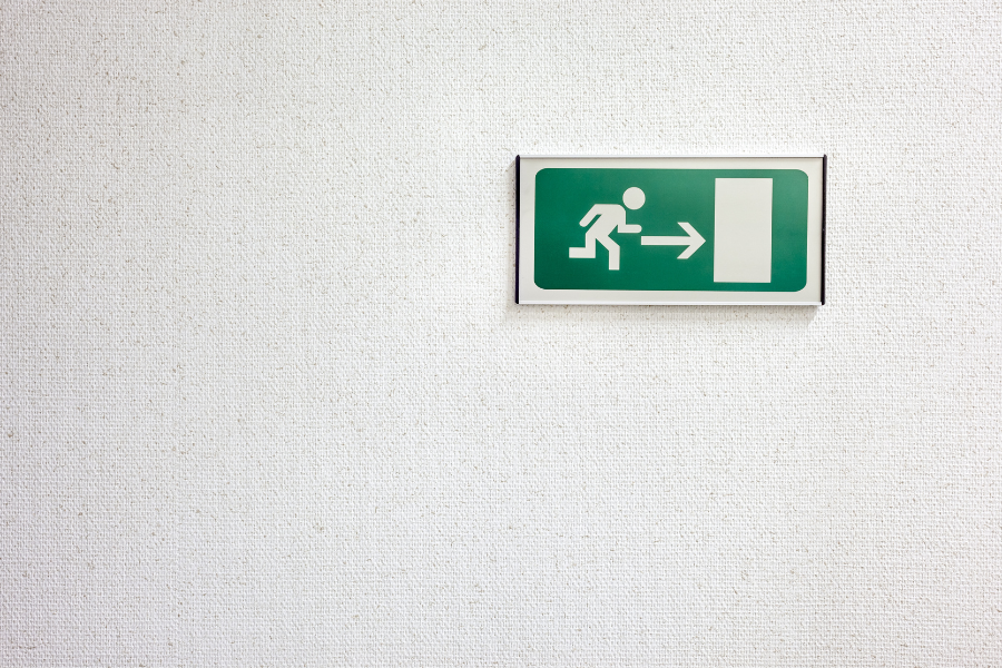 fire exit sign pointing right