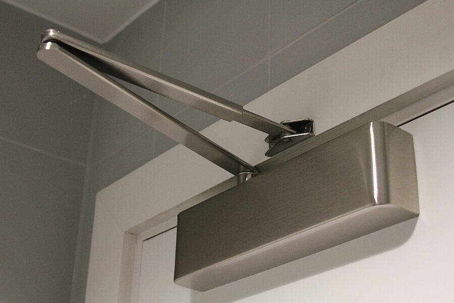 Automatic fire door closer in silver