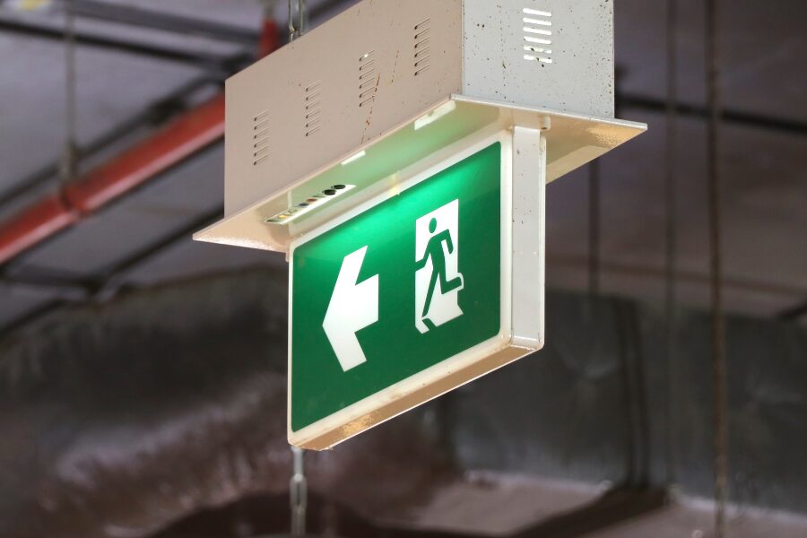 Blog-Featured-Header-Fire-escape-regulations fire exit sign pointing left