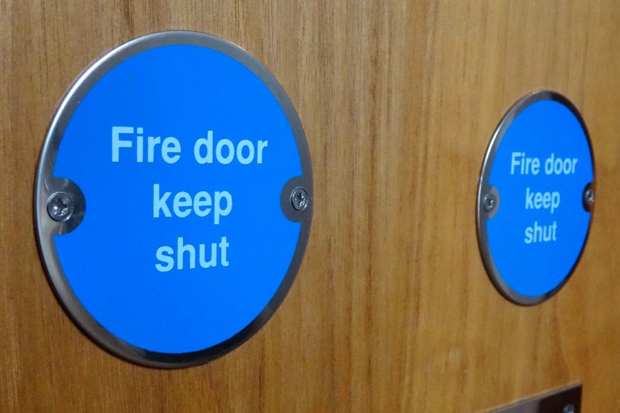fire door keep shut sign close up