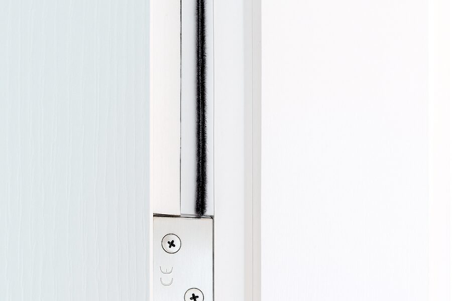 Intumescent strip break with hinge Intumescent strip with brush around fire door frame